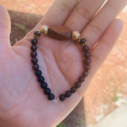 Garnet, Black Onxy, Gold Lava Rock And Wood Accent..